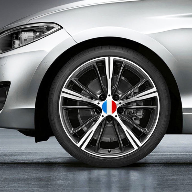 Round France flag wheel hub sticker centered on a multi-spoke alloy wheel