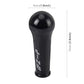 Black shift knob cover, 10cm tall and 4cm wide, with printed emblem