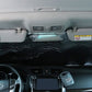 Hatchback windshield sunshade cover installed inside car, suction cups visible