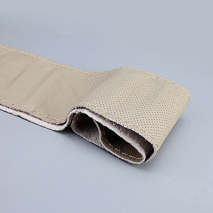 Beige leather steering wheel cover with perforated grip and stitched edge seam