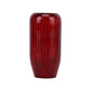 Red carbon-fiber style gear shift knob cover with rounded top.