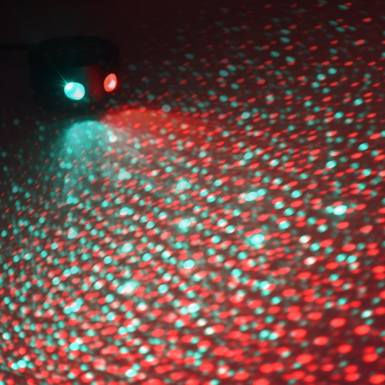 Car roof LED star projector close-up, red and green speckled galaxy light