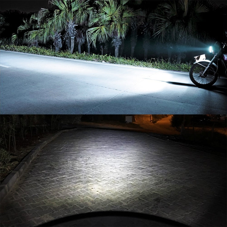 Motorcycle headlight beam illuminating road at night