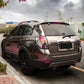 Metallic black vinyl decal applied to a car body panel, rear view