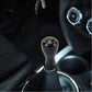 Black universal car gear shift knob with yellow 1-2-3-4-R markings