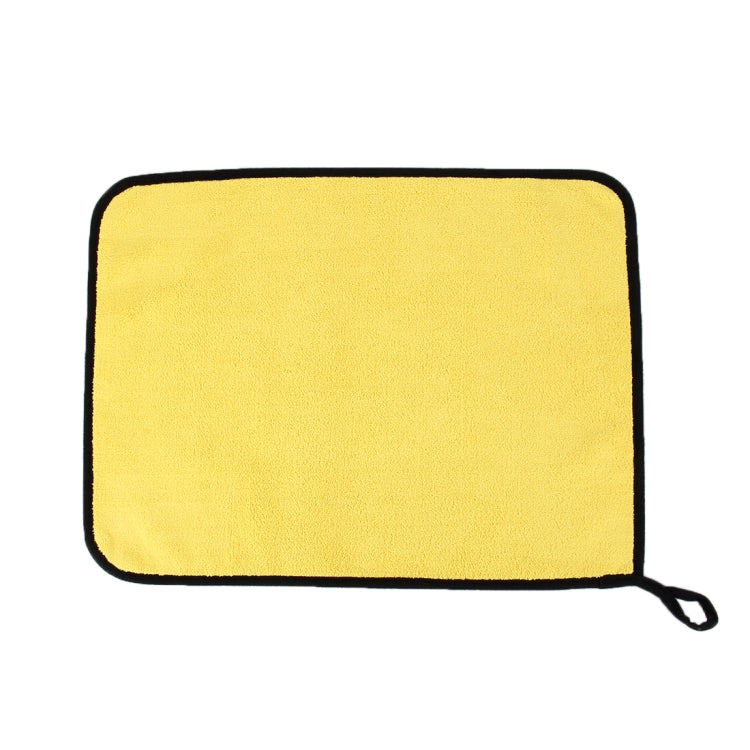 Microfiber cleaning towel, yellow rectangle with black edging and hanging loop.