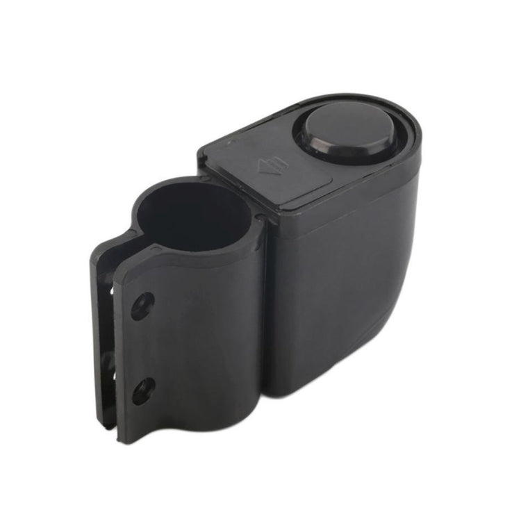 Black bicycle alarm mounting clamp housing with circular top sensor cover