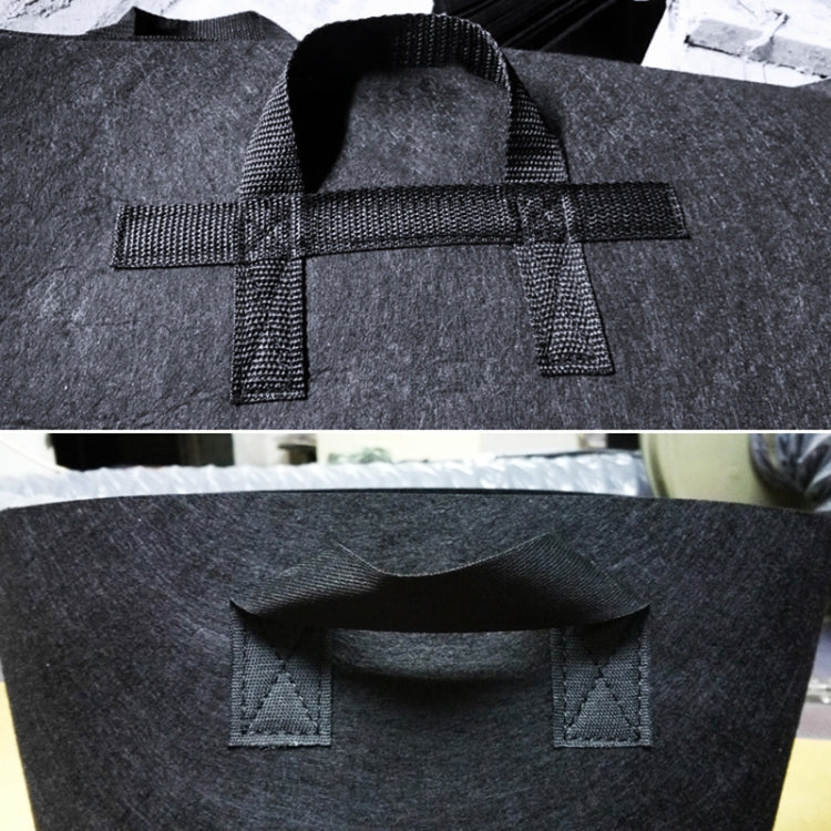 Reinforced carry handle straps on dark black fabric grow bag, open top