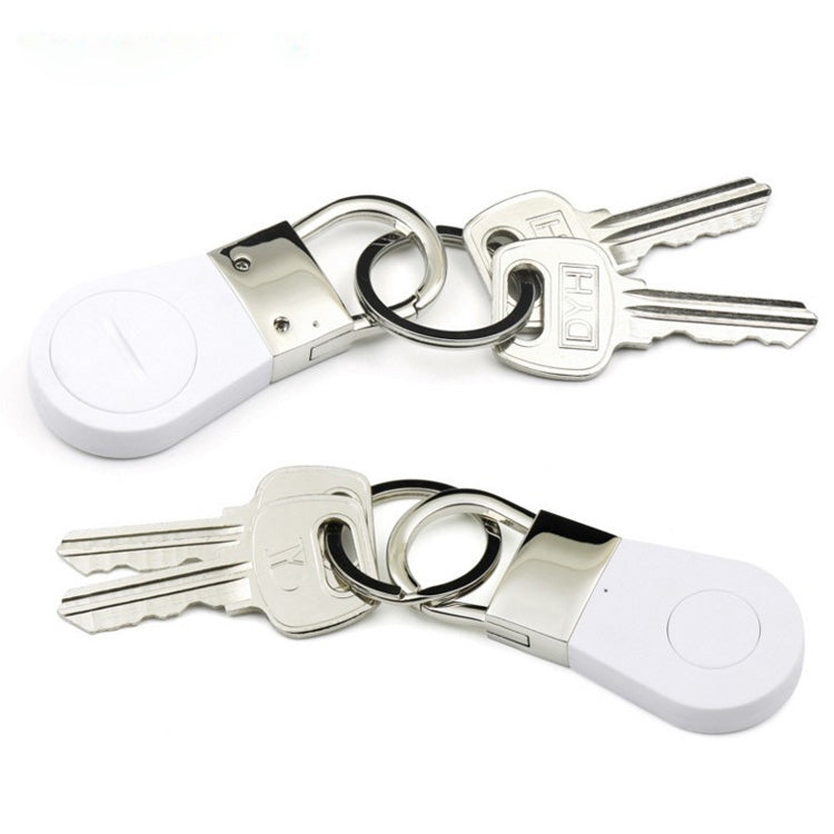 White key finder tracker attached to key ring with two keys