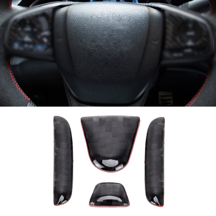 Black leather steering wheel with red trim stitching around rim and center hub