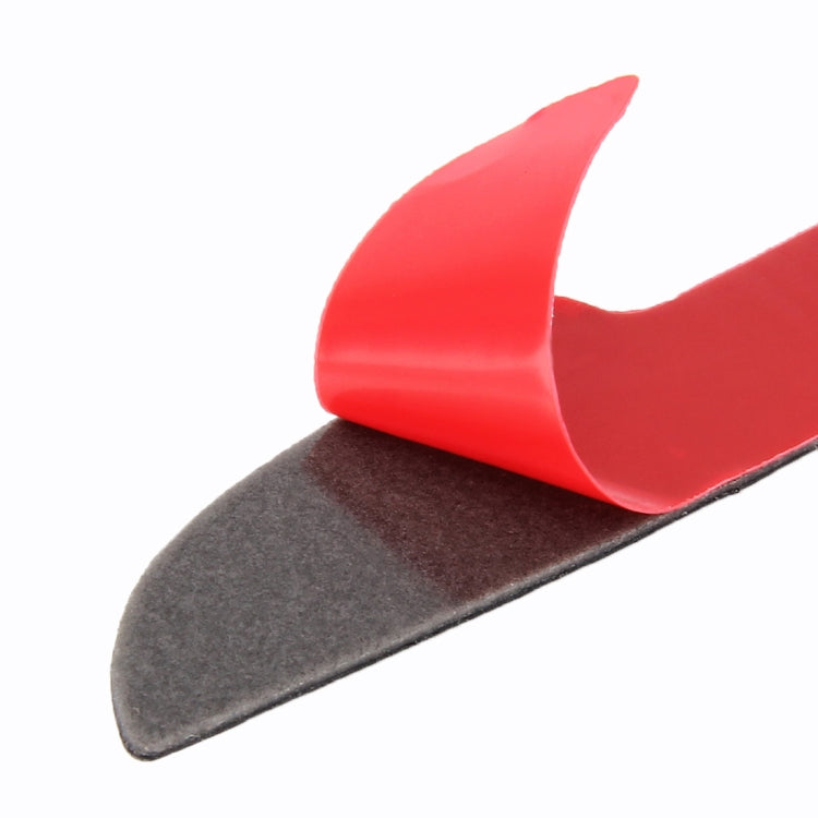 Red door edge guard top over black base with curved shape and raised adhesive edge.