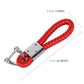 Braided red leather keyring with crystal-inlaid silver clasp; approx. 11cm length.