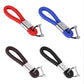 Assorted braided leather keyrings in red, blue, brown, and black with crystal inlay.