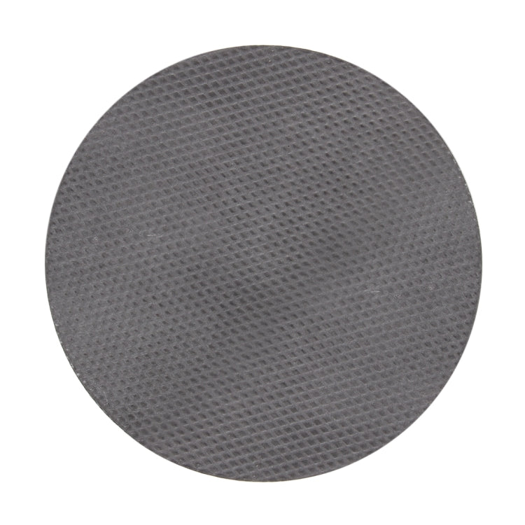 Single round black foam grinding disk pad with fine textured pattern