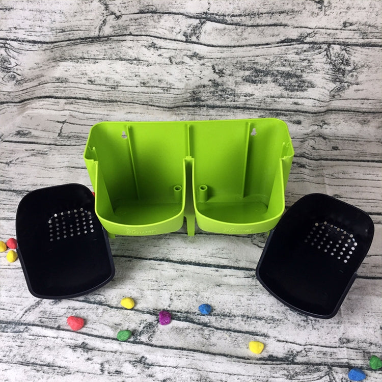 Lime green wall planter unit with two black pots filled with soil and plants