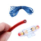 Red car audio power cable with transparent fuse holder, held in hand
