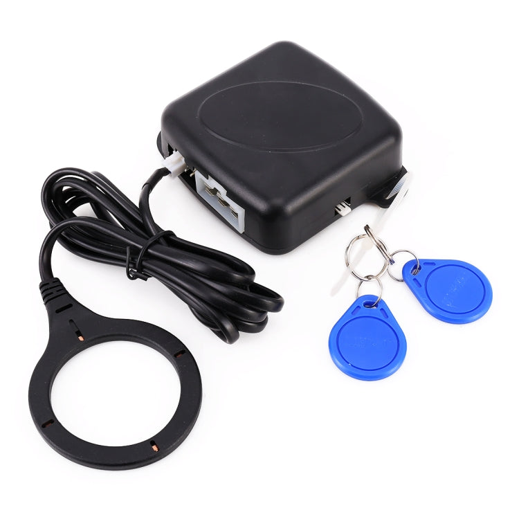 Black control module with connector cable, key fobs, and mounting ring