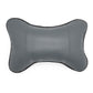 Dark charcoal leather car neck pillow with perforated center and rounded bone shape