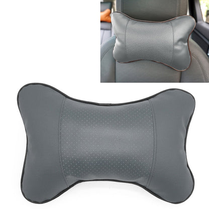 Gray breathable leather car neck pillow with bone-shaped design and perforated center