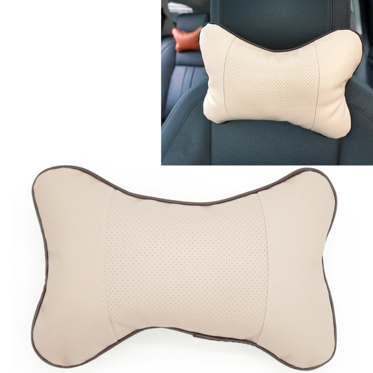 Beige leather car neck pillow with dark trim and perforated center panel