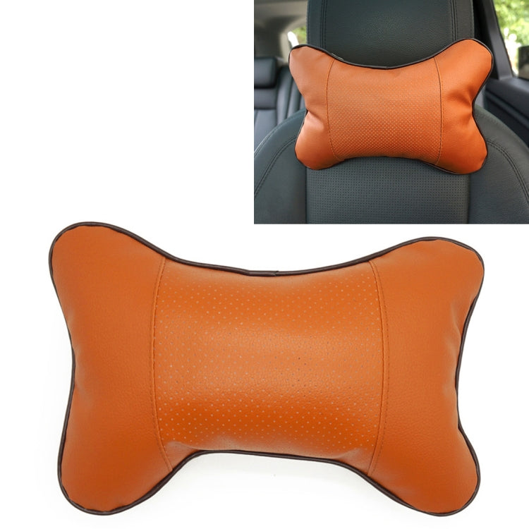 Orange leather car neck pillow with perforated center panel and padded bone shape