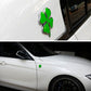 Four-leaf clover emblem sticker on white car body, green clover with chrome edge