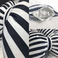 Close-up of black-and-white striped bowknot car cushion pillow