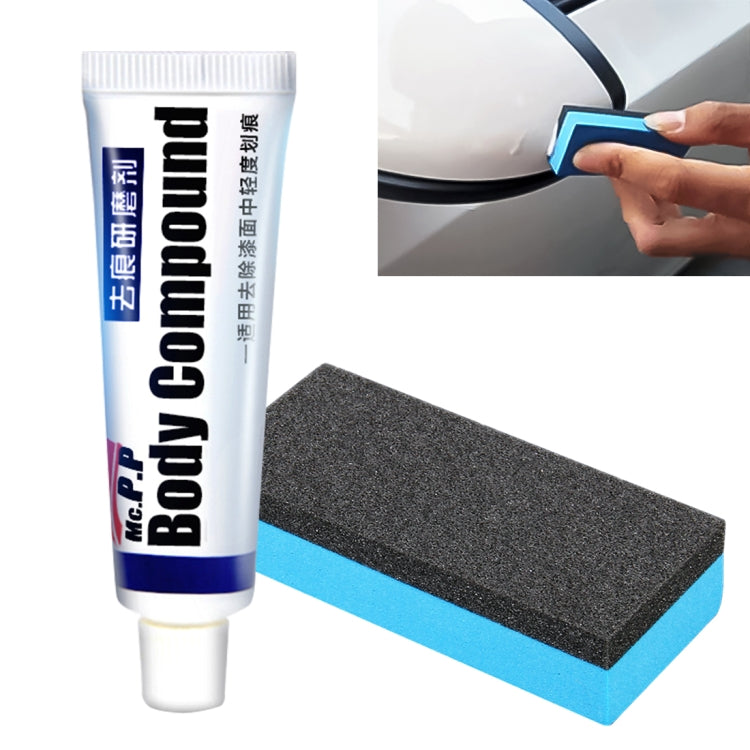 Car body compound tube with blue label and dark gray polishing sponge block