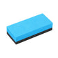 Polishing sponge block with blue foam body and dark abrasive side