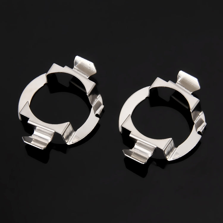 Pair of chrome metal circular retainer clips with four mounting tabs each