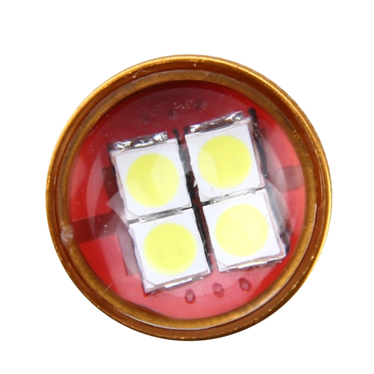 LED chip array close-up in gold-rimmed housing with red lens cover