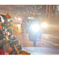 Motorcycle LED headlights shining bright white during night traffic