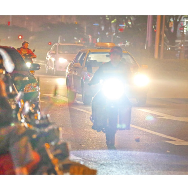 Motorcycle LED headlights shining bright white during night traffic
