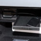Black audio cable harness in vehicle console bay with connector end