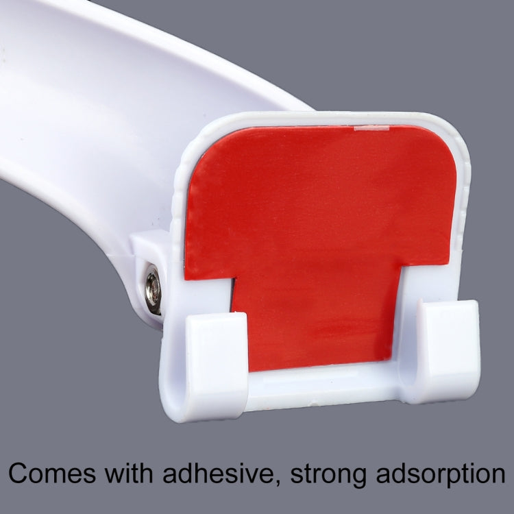 Close-up of white auxiliary mirror adhesive base with red backing