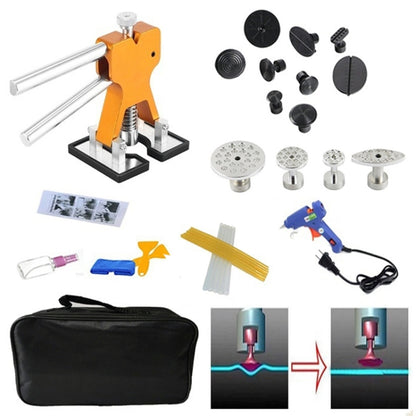 Auto dent glue puller kit with orange tab lifter, glue gun, and accessory set