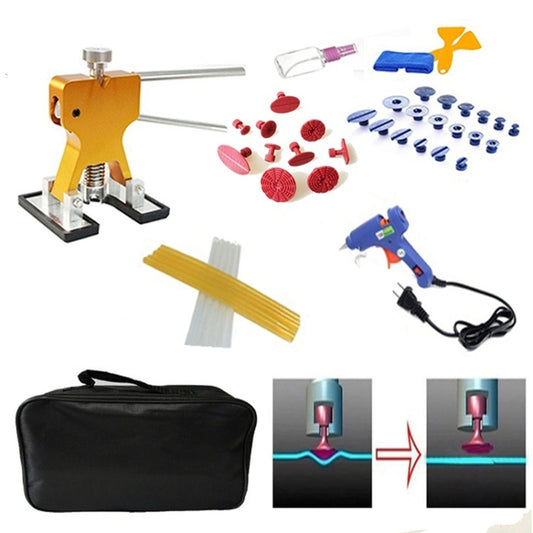 Car dent repair puller kit with orange tool, blue glue gun, tabs, and storage bag