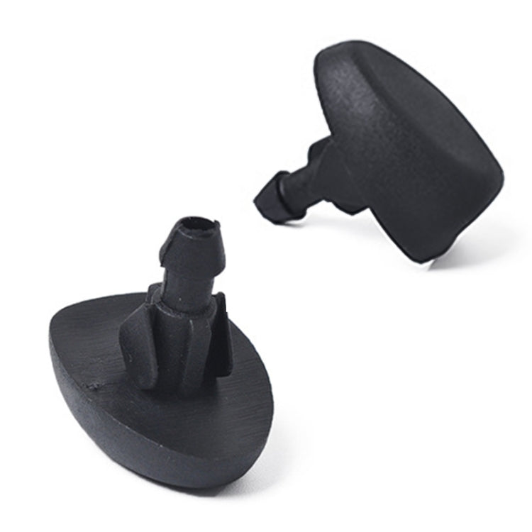 Two black windshield washer jet nozzles showing spray tip and mounting base