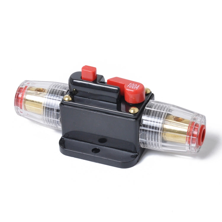 DC fuse holder with transparent cartridge, black base, and red 100A button