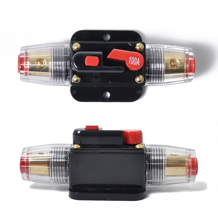 DC fuse holder with transparent cartridges, black cover, and red 100A marking