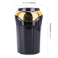Gold and black car ashtray lighter measuring 8cm wide and 12.5cm tall