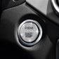 Round engine start/stop button cover with ENGINE START STOP lettering