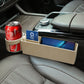 Beige seat side storage box holding drink can and phone, open-front design