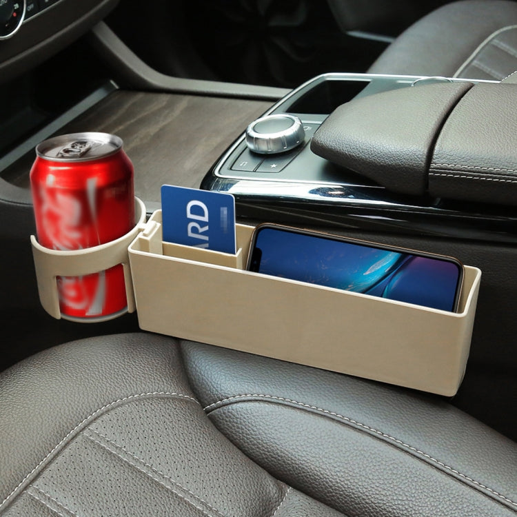 Beige seat side storage box holding drink can and phone, open-front design