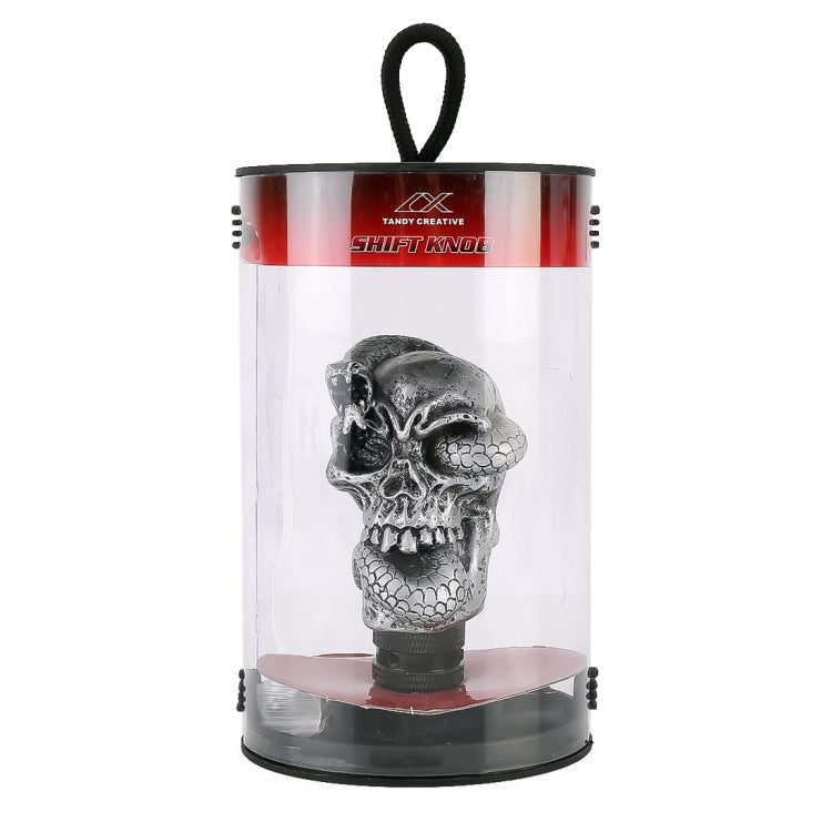Snake-ghost skull gear shift knob in clear box with red top and hanging handle