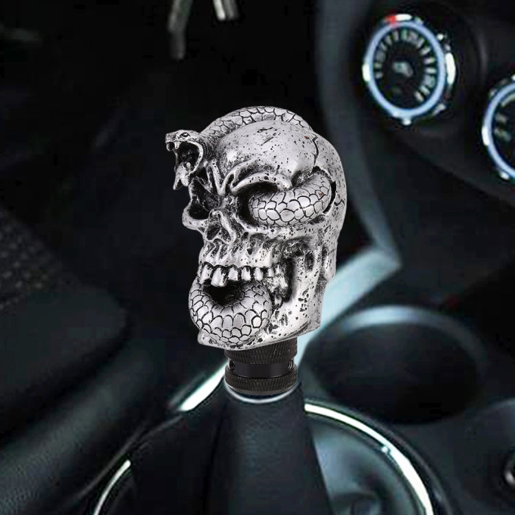 Snake-ghost skull gear shift knob on car shifter, textured silver finish with black ring