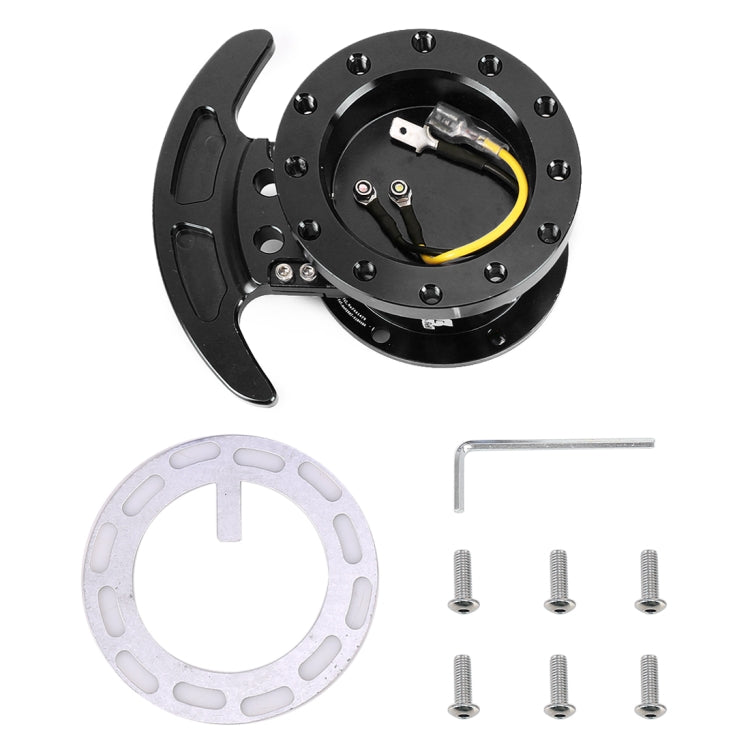 Black steering wheel hub quick release adapter kit with wiring, screws, and ring spacer.