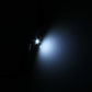 Wedge LED bulb glowing with bright white light beam