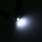 T3 0.5W LED bulb producing a bright white light beam from a black base