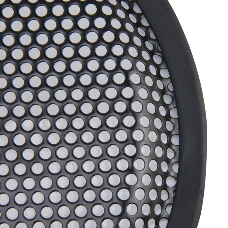 Close-up of black perforated metal mesh for a round subwoofer cover